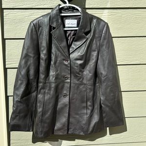 Brown leather jacket, lined. Shoulder pads. Size large. Lord and Taylor brand.